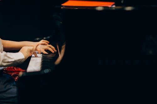 People Playing Piano Together