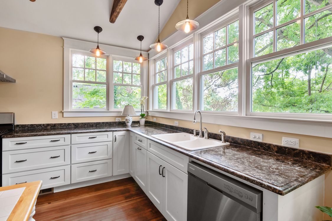 White Wooden Kitchen Cabinet Near Window