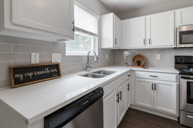 Bright modern kitchen with white cabinetry