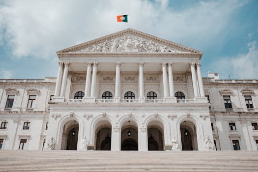 Front view of the historic São Bento Palace in Lisbon, showcasing its grand architecture and Portuguese flag.