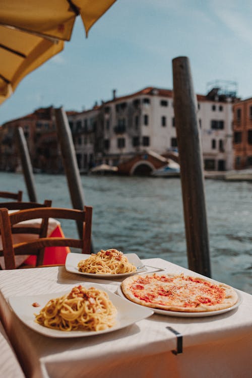 Pizza and Pasta on White Ceramic Plate