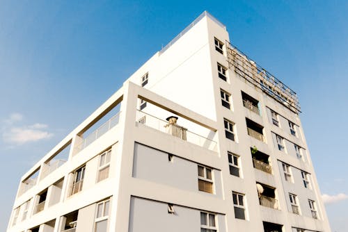 White Concrete Building Under the Blue Sky