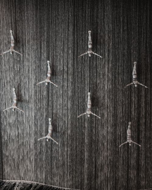 Free Sculptural divers creating a stunning visual waterfall scene indoors, artistic and modern. Stock Photo