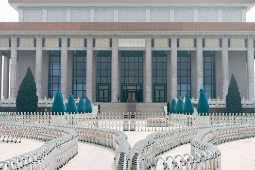 White and Blue Chairs on White Concrete Building