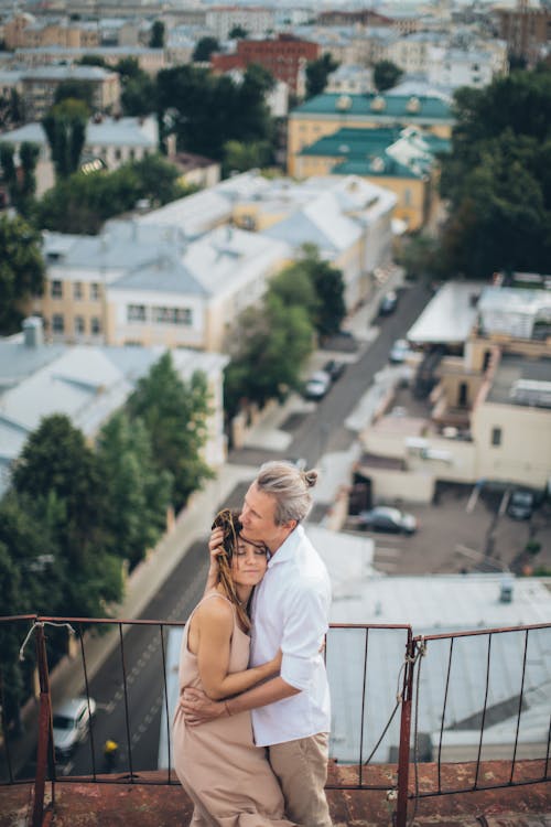 Couple Hugging Each Other on Roof Top