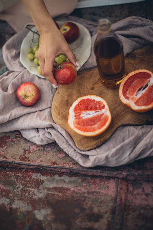 Crop woman having fresh healthy snack