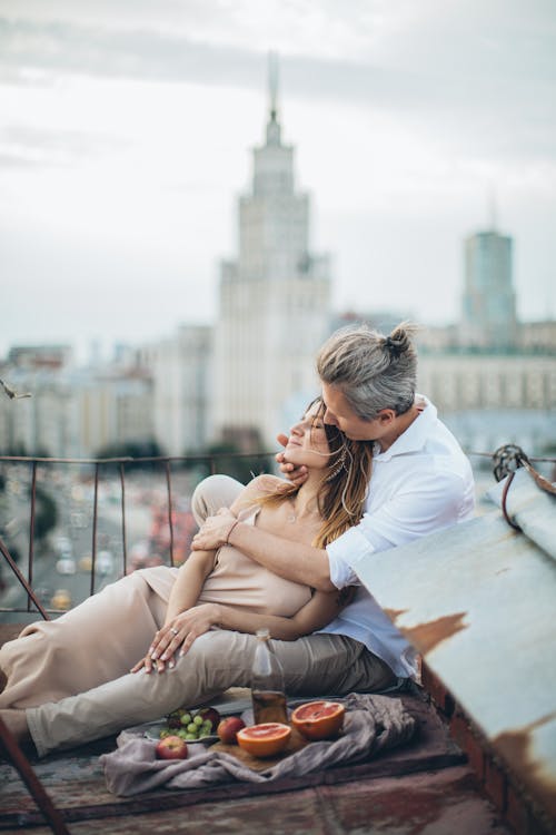 Loving couple embracing on rooftop during date