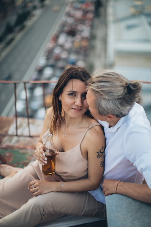 Happy couple caressing on rooftop in summer