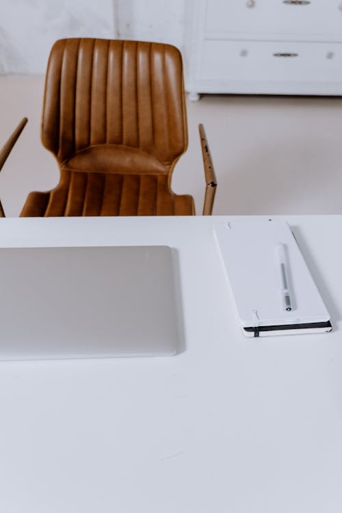 White Laptop Computer on White Table