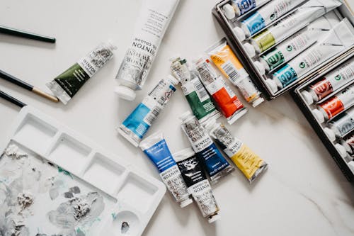 Free White and Blue Plastic Tube Acrylic Paints Stock Photo