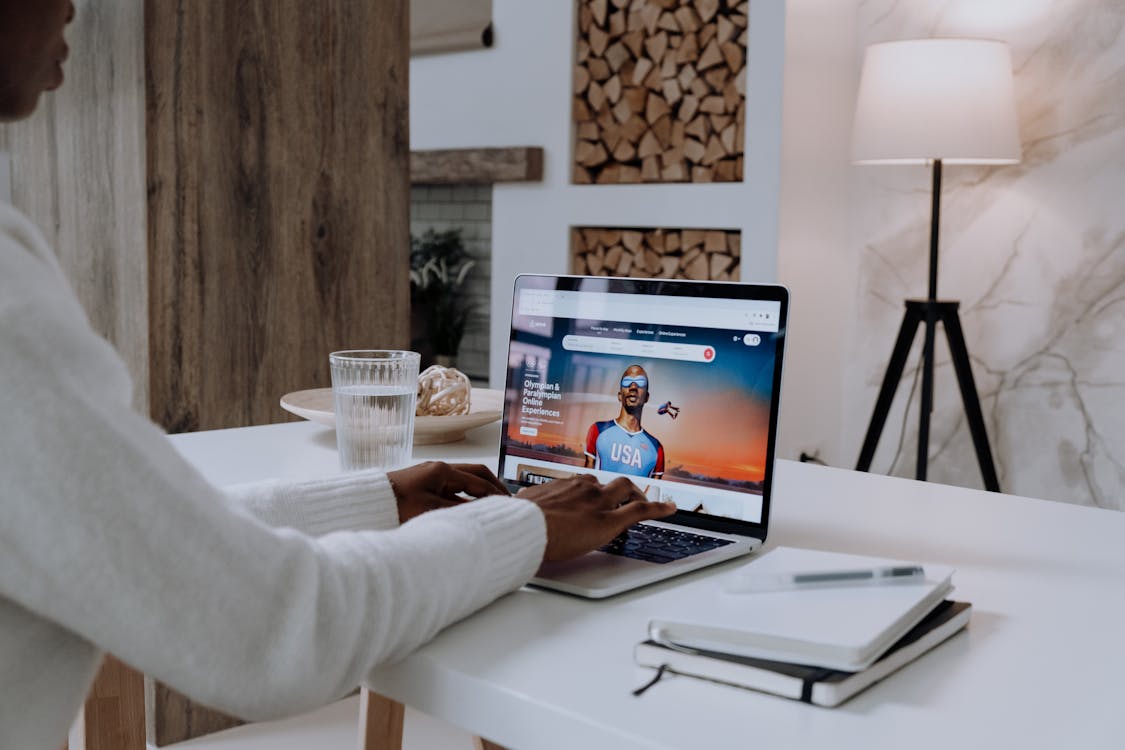 Free Person in White Long Sleeve Shirt Using Macbook Pro Stock Photo