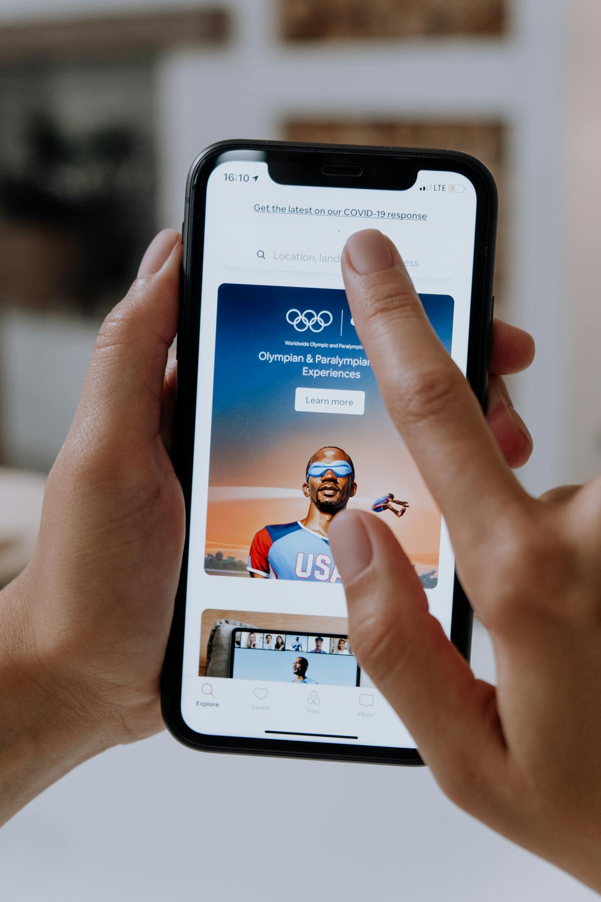 Conference panel discussing technology and media with speakers on a stage