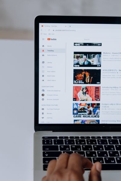 Person browsing videos on a laptop