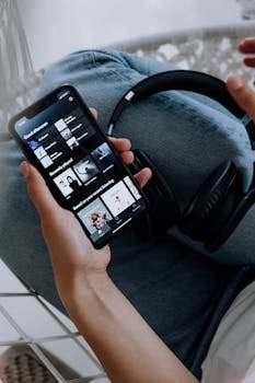 Person Using Spotify on an Iphone