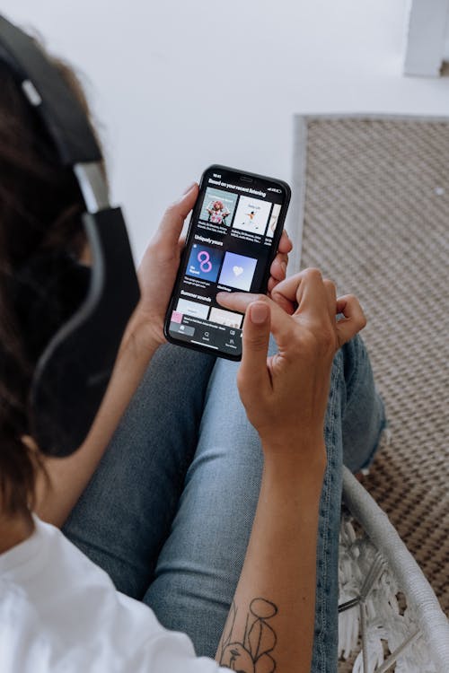 Person Listening to Music on a Smartphone