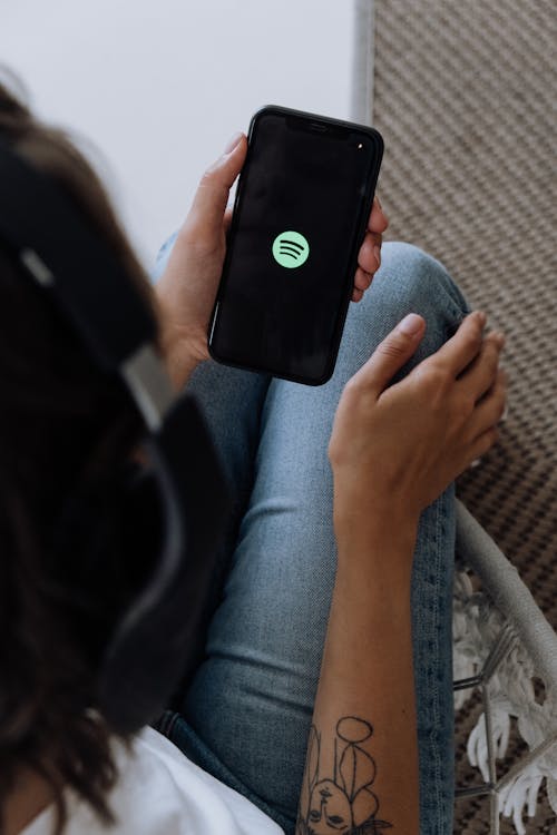 Free Listening to Music on a Smartphone Stock Photo
