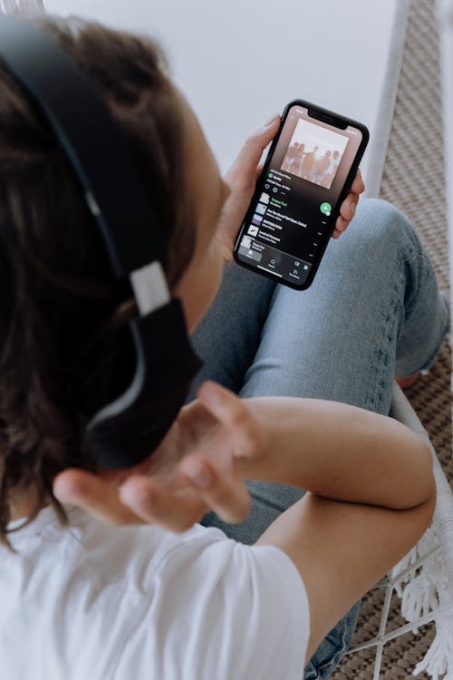 Free Person Hearing Music on a Smartphone Stock Photo