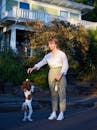 Woman Teaching Tricks to her Dog 