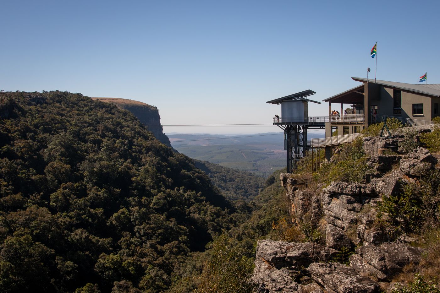 Forested cliffs and the viewing facility at Graskop Gorge