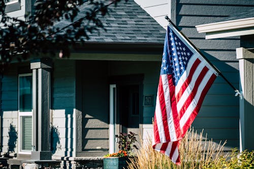 American Flag Waving Outside A House