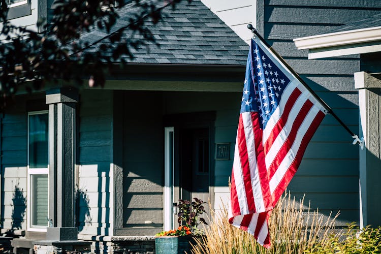 American Flag Waving Outside A House