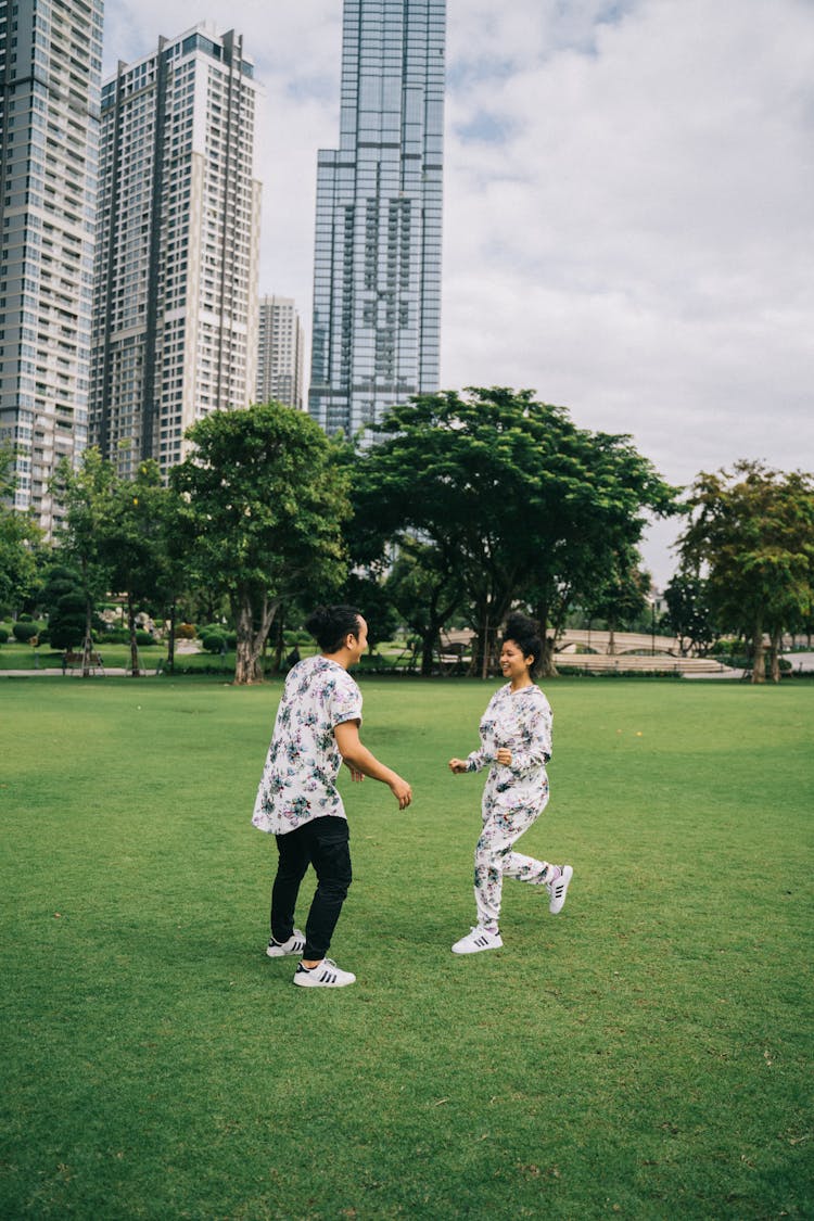 A Couple Running In The Park