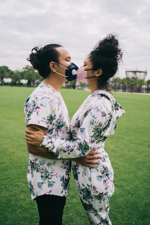 Couple Wearing Face Masks Kissing