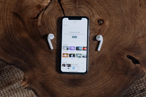 Free Smartphone and Wireless Headphones Stock Photo