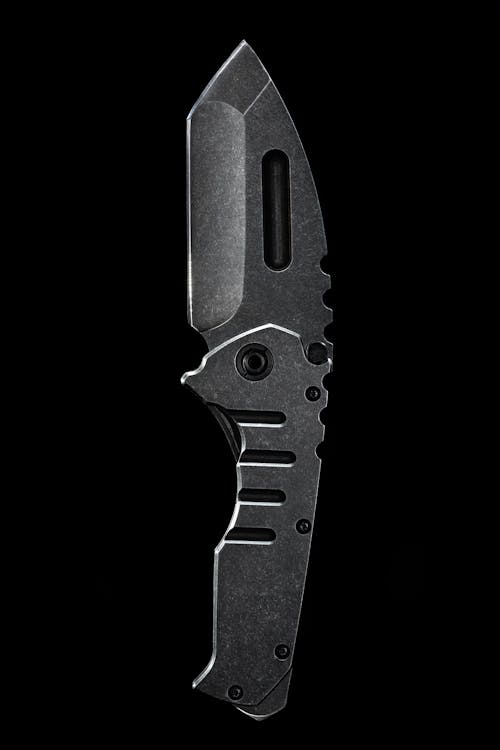 Close-up of a Silver Knife on Black Background 