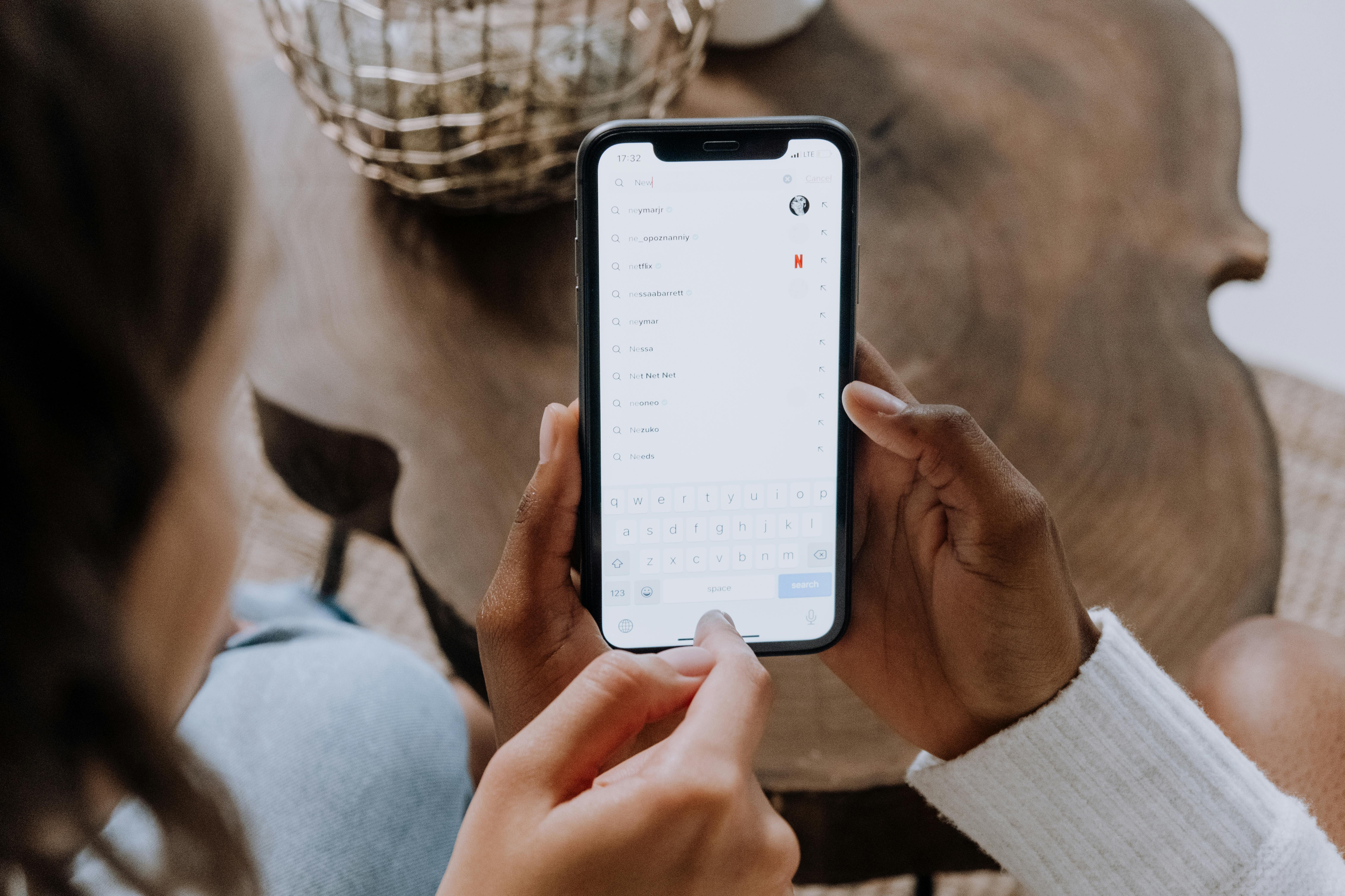 person holding silver iphone