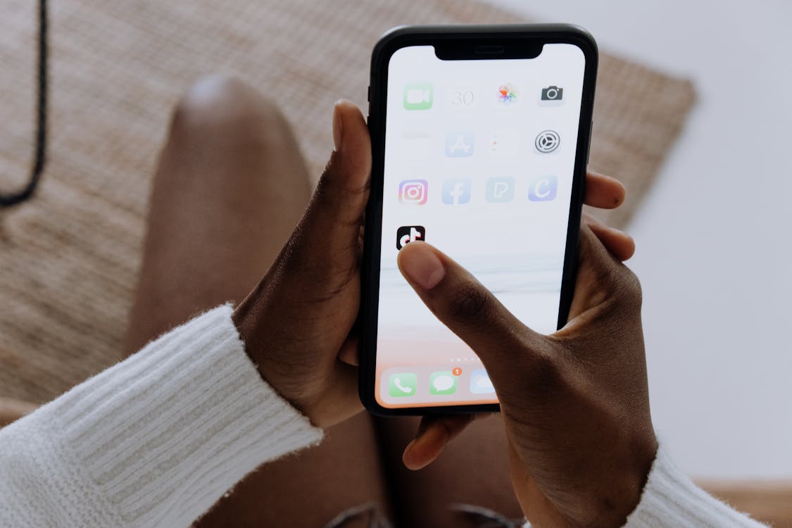 Free Person Holding Black Iphone 4 Stock Photo