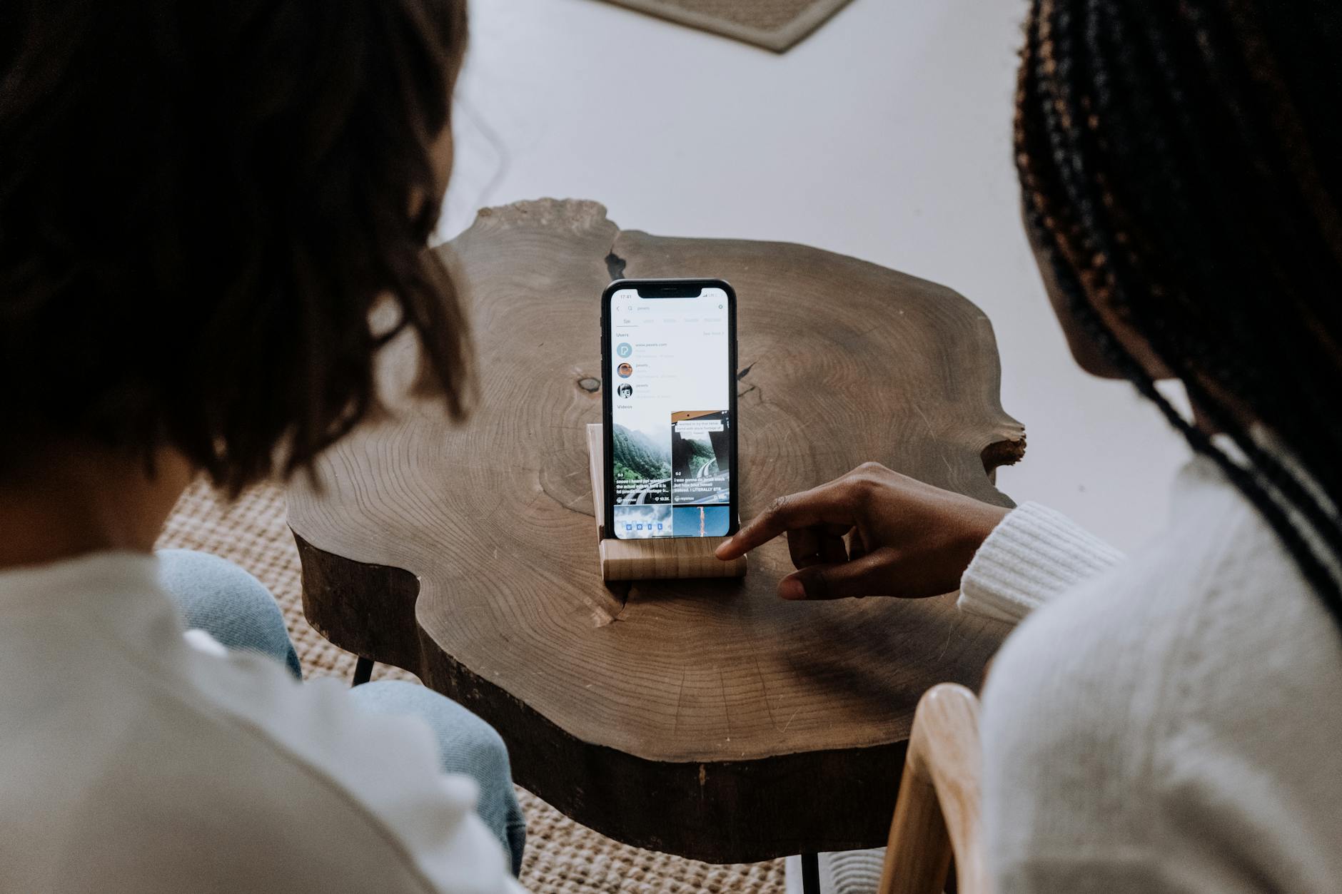 https://www.pexels.com/photo/woman-in-white-long-sleeve-shirt-holding-silver-iphone-6-5081921/