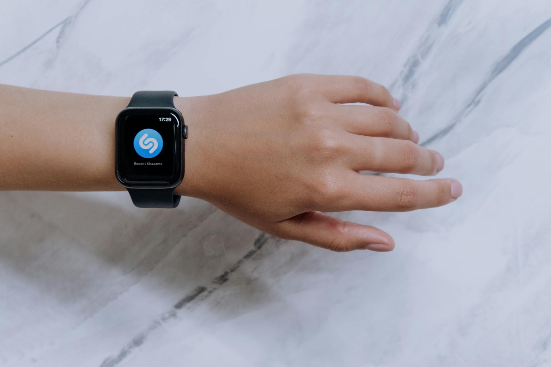 Person Wearing Black Apple Watch