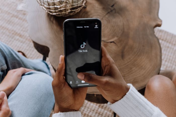 Creator holding phone for social commerce