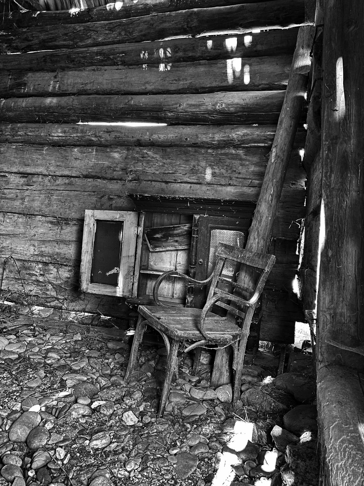 Person scrolling through music content on a smartphone with headphones on