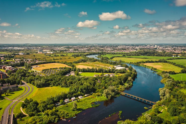 Aerial Photography Of A River Shannon Surrounded By Green Field 