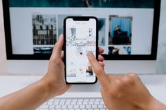 Person checking event information on a phone