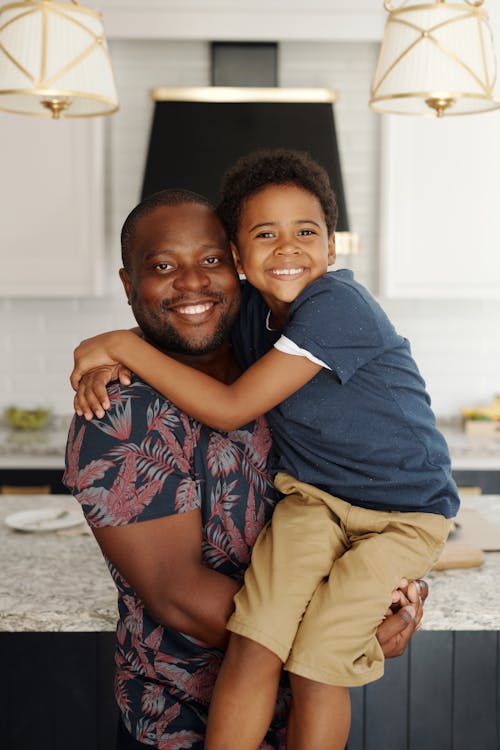 Man Carrying a Boy