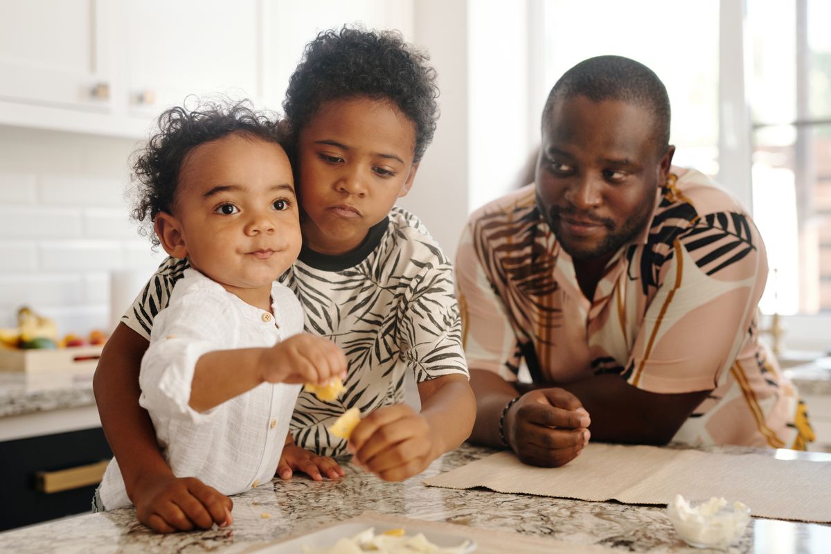 Father baking with his children in the kitchen