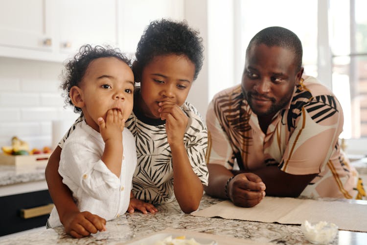 A Family Sitting At The Table