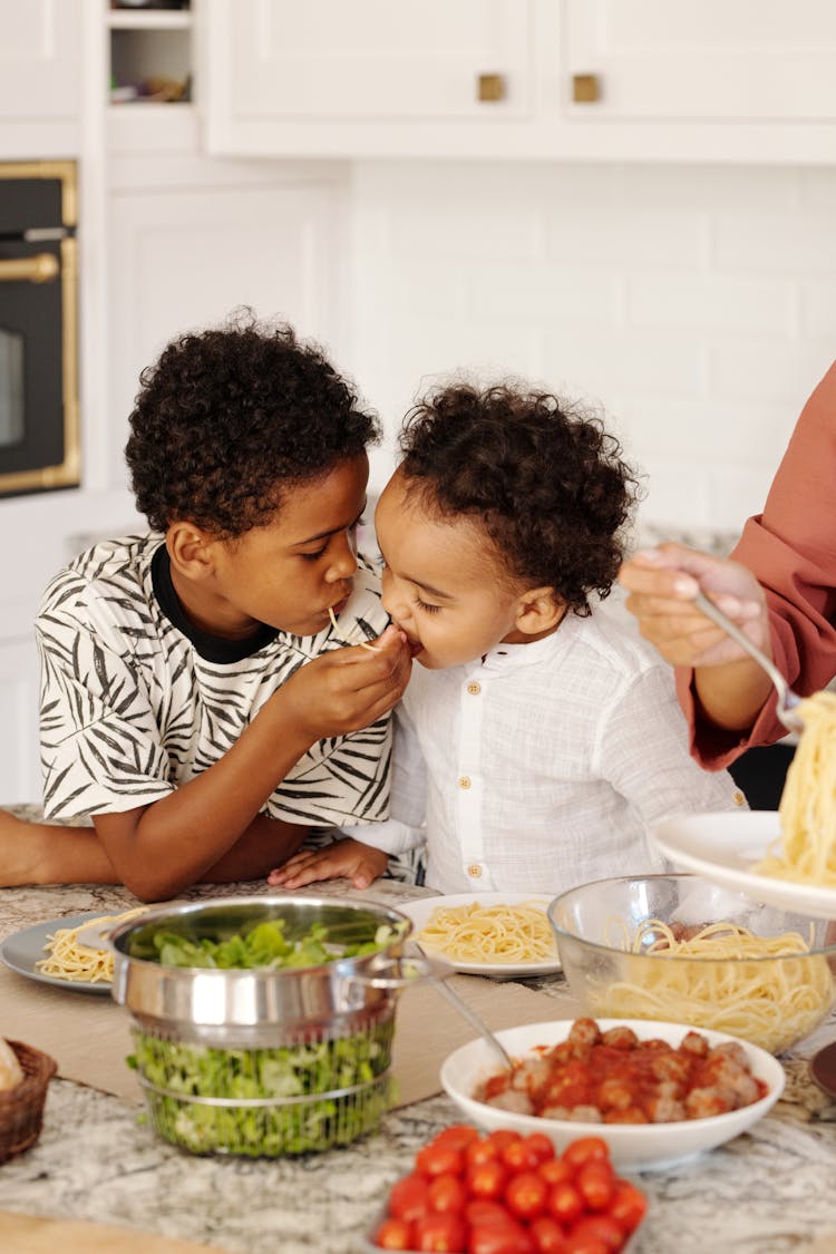 Young Brothers Eating Together