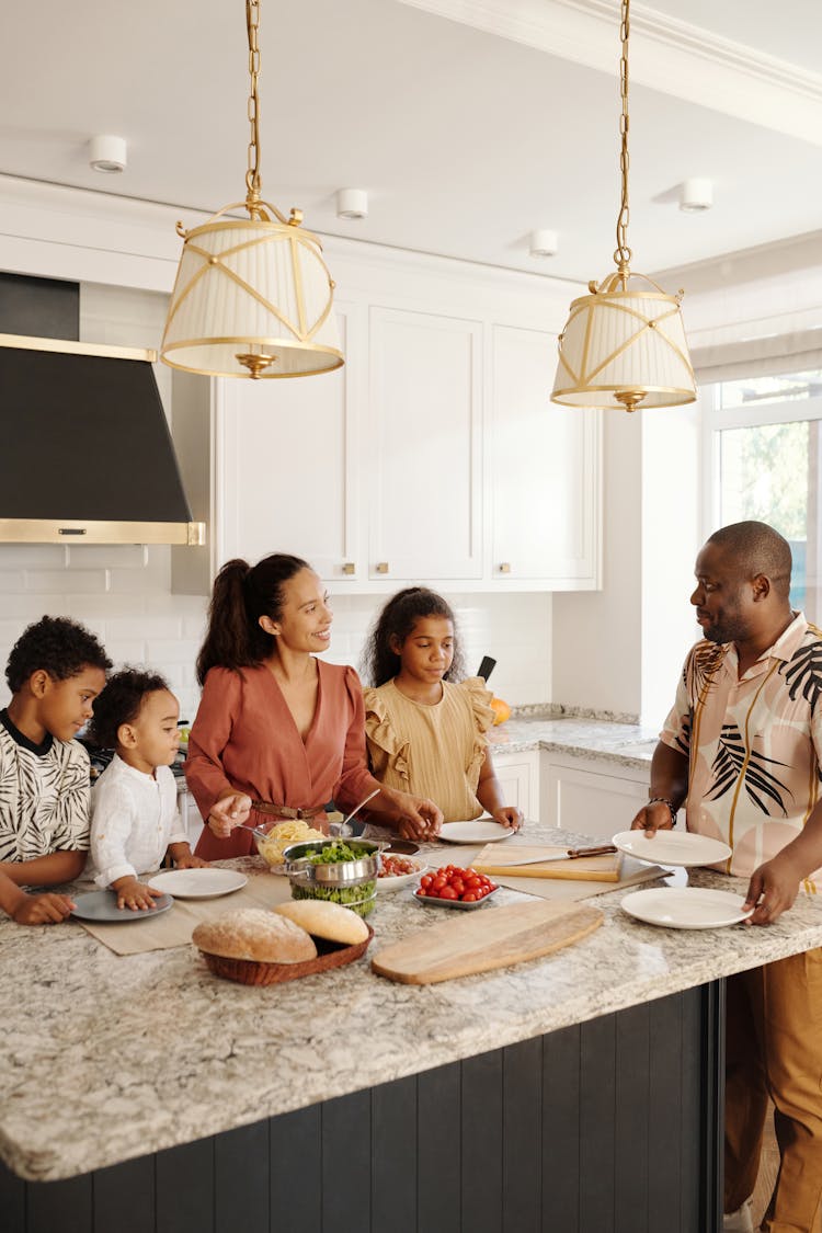 A Group Of People Inside The Kitchen