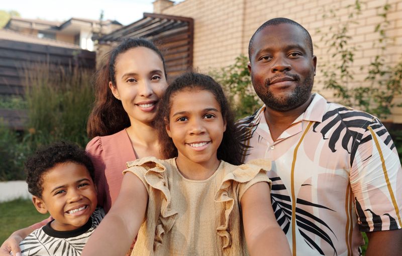 A family photographed in their finished garden