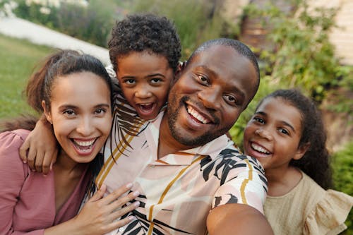Free A Family Smiling for a Groupie Photo Shot Stock Photo
