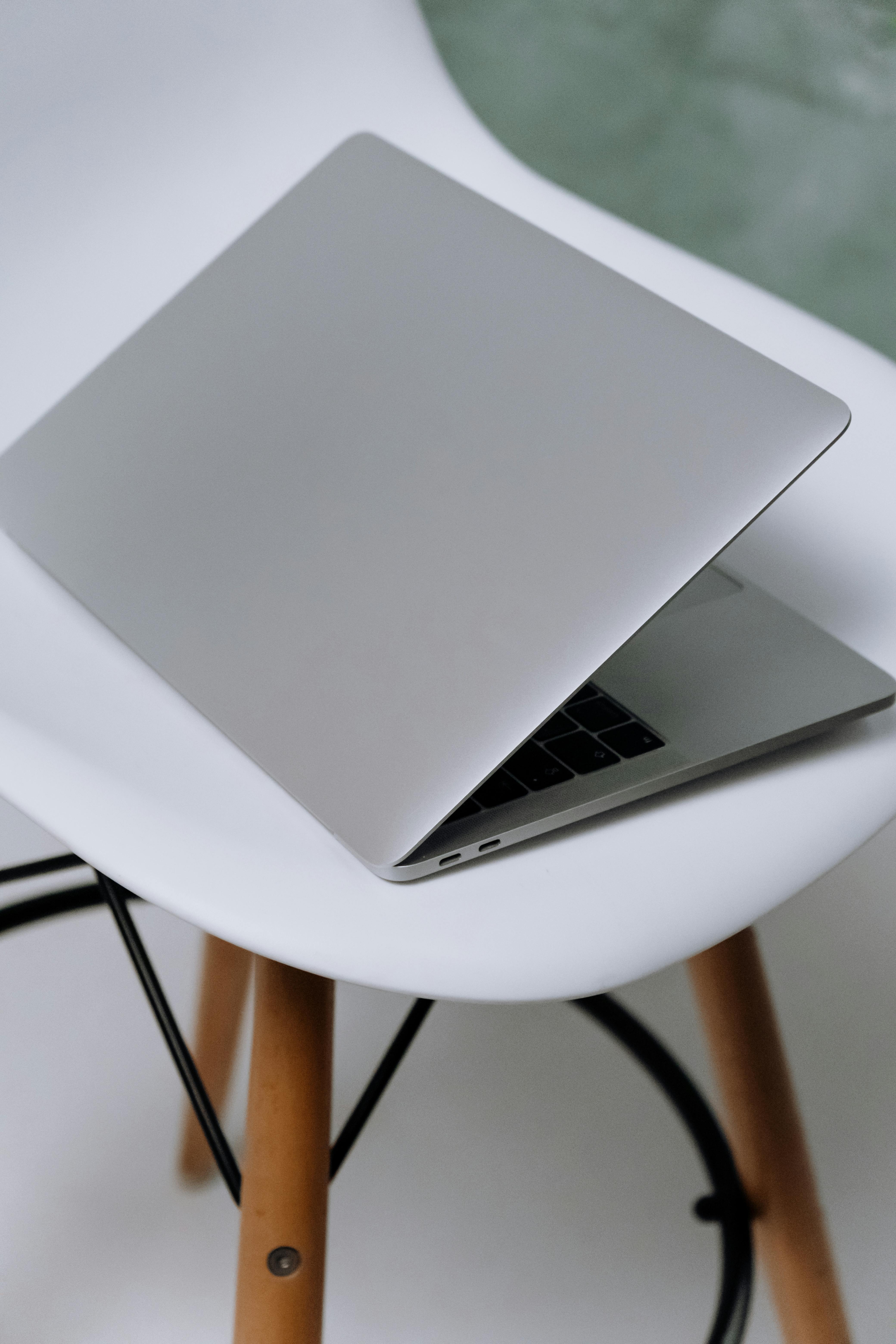 macbook air on white round table