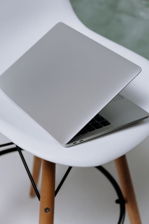 Macbook Air on White Round Table