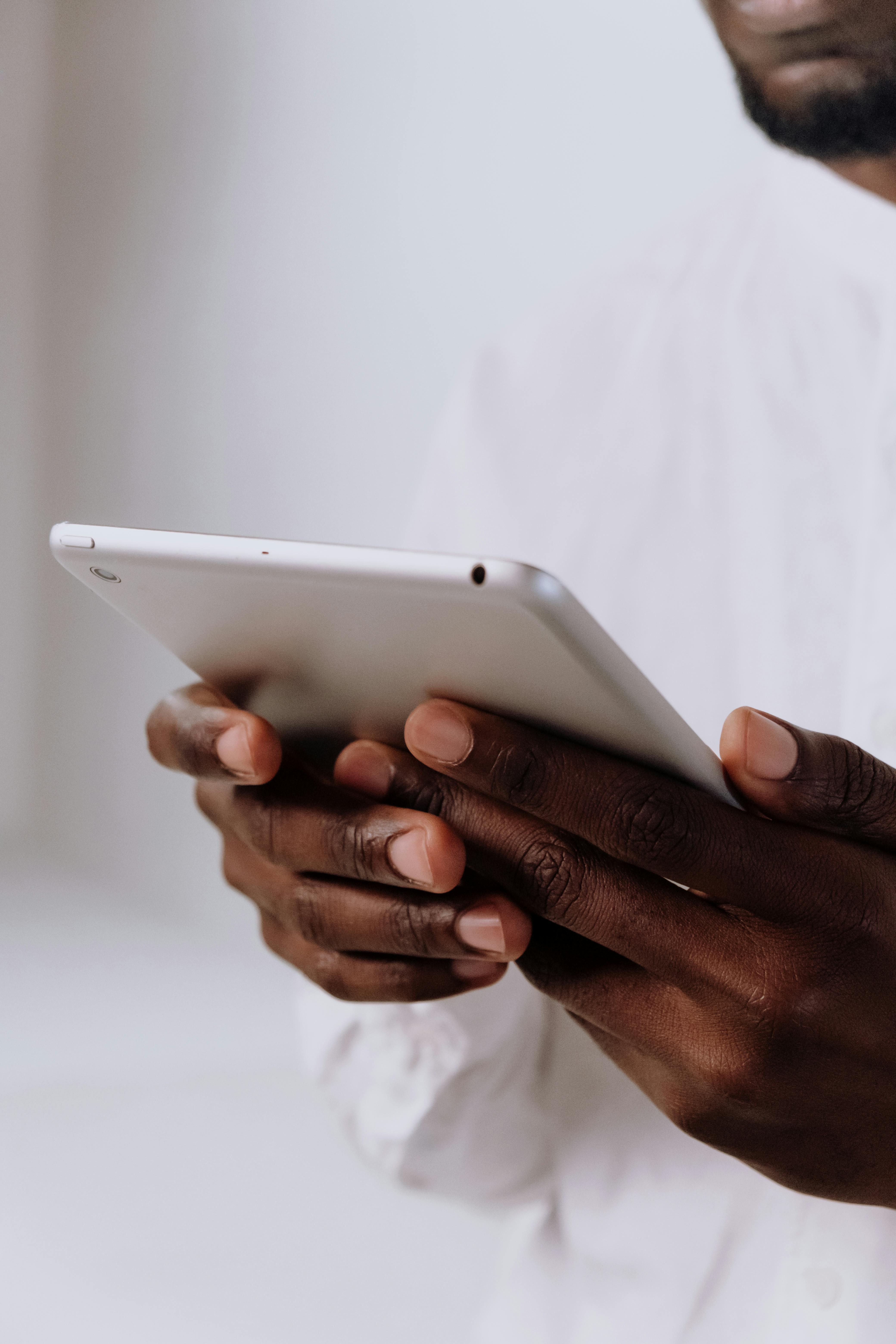 person holding silver iphone