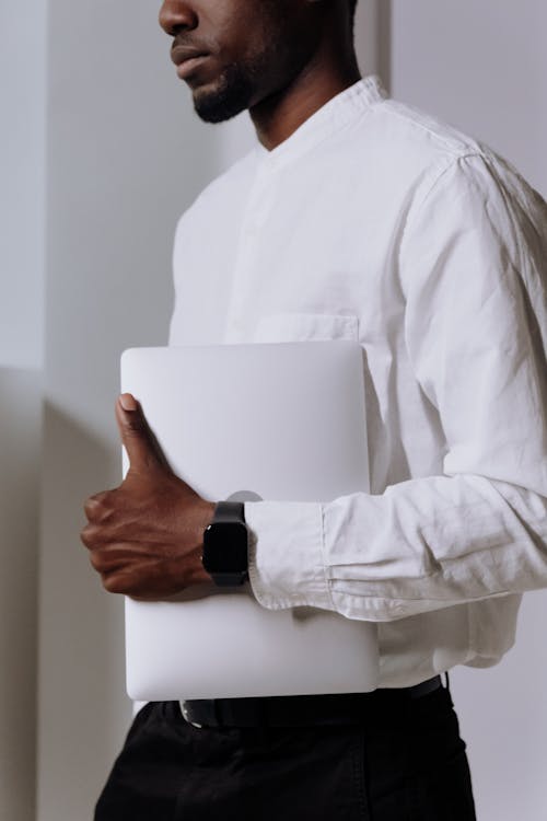 Free Man in White Dress Shirt Holding White Paper Stock Photo