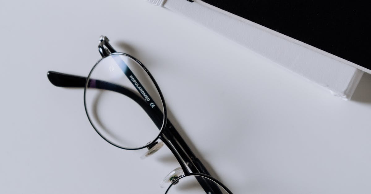 Black Framed Eyeglasses on White Table · Free Stock Photo
