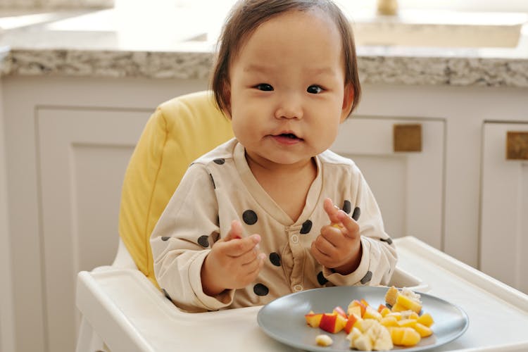 A Child Eating Fresh Fruits